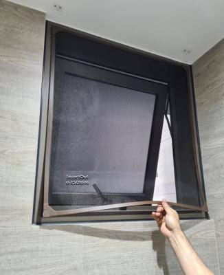 Condo bathroom top-hung window in Brown at Seng Kang